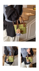Green diamond quilted bucket bag with brown faux leather trim and cute bear charm