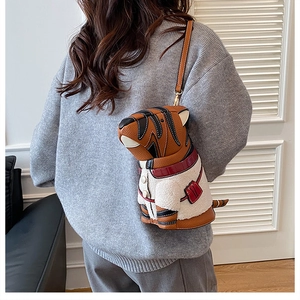 Close-up of a creative tiger-shaped shoulder bag featuring plush vest and leather straps