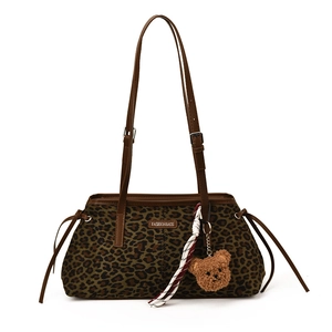Leopard print underarm bag with teddy bear charm and striped silk scarf decoration