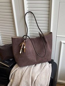 Vintage dark brown suede tote bag with leather straps and decorative bead tassels