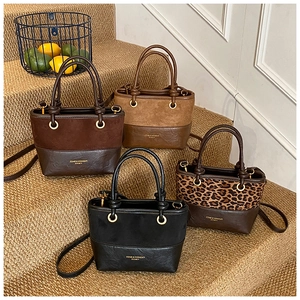 Detailed view of retro patchwork bucket bags in brown, black, and leopard print styles