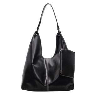 Black PU leather tote bag with white contrast stitching and a matching zipper pouch