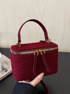 Elegant burgundy velvet box bag with quilted pattern and gold zipper detail