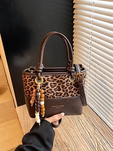 Retro leopard print patchwork bucket bag with leather handles and colorful beaded tassels