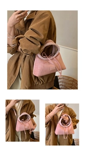 Detailed views of pink suede handbag showing crossbody, shoulder, and handheld styles