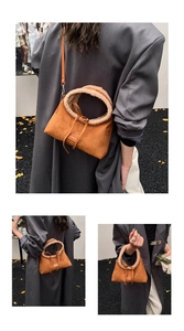 Close-up of caramel tote bag with plush beige handles and drawstring detail