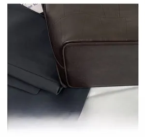 Close-up of precise stitching on vintage coffee leather tote bag base corner