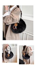 Detail of black faux fur crescent bag with wooden bead strap and cute plush charm