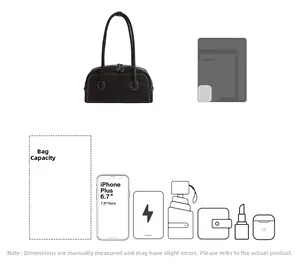 Sac bandoulière spacieux en daim noir montrant la capacité pour téléphone et tablette