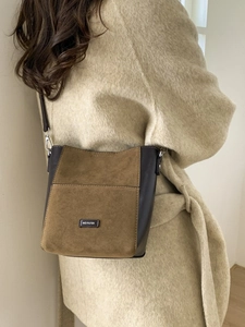 Brown leather and suede leopard bucket bag with NO FILTER tag shown on model