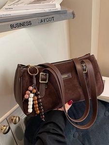 Vintage dark brown suede shoulder bag with beaded charm and stylish leather trim details