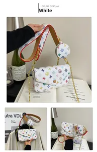 Detail of white crossbody bag with colorful patterns, wide strap and mini coin purse