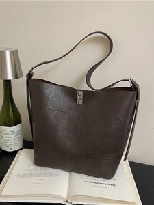 Vintage dark brown leather tote bag with silver twist lock and retro shoulder straps