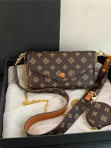 Brown monogram crossbody bag set with wide strap and round coin purse on silk fabric
