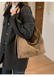 Deep brown faux suede tote bag on model showing large capacity and retro minimalist style
