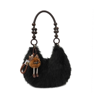 Black fuzzy hobo bag with beaded rope handle and cute owl charm detail for winter fashion
