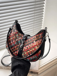 Chic multi-color woven crescent handbag with black leather trim and silver metal buckle