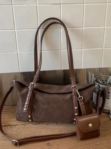 Retro dark brown suede underarm bag with silver rivets and adjustable shoulder strap