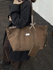 Large dark brown suede tote bag for women with fashion label and checkered ribbon bow