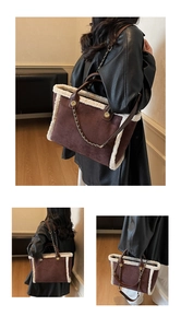 Detail of the brown suede tote bag featuring plush white faux fur trim and gold chain strap