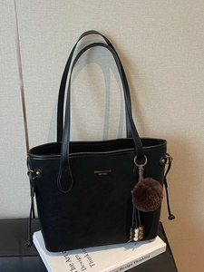 Black minimalist large capacity tote bag in matte faux leather with plush ball charm