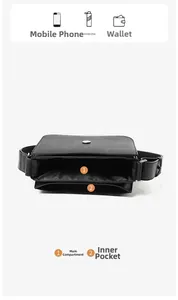 Internal structure of black leather crossbody bag showing main pocket and front compartment