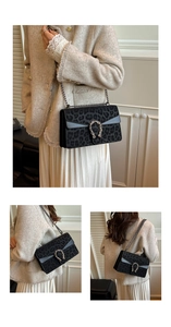 Detailed view of leopard print crossbody bag featuring vintage tiger head metal buckle