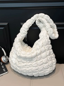 Quilted white heart pattern cloud bag with pleated design and soft knotted shoulder strap