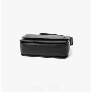 Detailed bottom view of the black crossbody bag featuring durable Saffiano leather texture