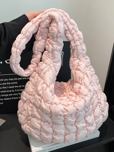 Pink quilted cloud shoulder bag with puffy texture and zip closure for women