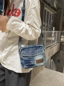 Vintage blue washed denim crossbody bag for women with adjustable strap and leather patch