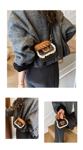 Detail of crossbody bag with lace edges, bear patch and plush croissant handle