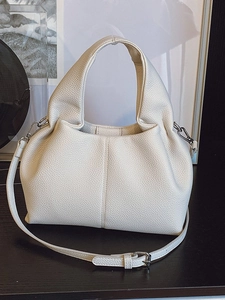 White ruched cloud dumpling bag in lychee leather with adjustable shoulder strap
