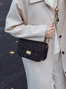 Chic black quilted crossbody bag for women with gold chain strap and metal turn-lock