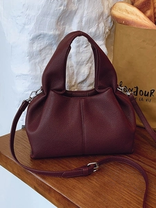 Elegant burgundy lychee leather pleated cloud bag with wide handle and shoulder strap