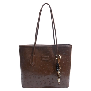 Large capacity brown embossed tote bag with puppy patterns and beaded charm strap