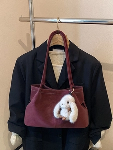 Minimalist large burgundy tote bag with contrast stitching and cute rabbit charm