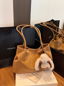 Minimalist camel large capacity tote bag with white plush rabbit pendant for work and commute
