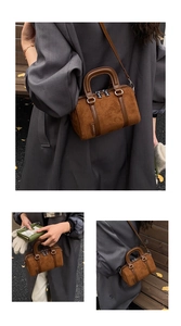 Detailed views of a brown suede vintage Boston bag showing animal embossed texture and strap