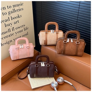 Mini Boston handbags in four colors featuring embossed animal patterns on matte fabric