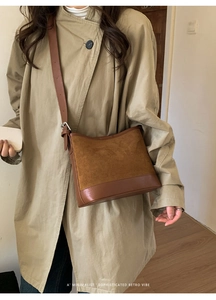 Brown retro shoulder bag detail showing suede and smooth leather patchwork textures
