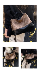 Detail view of large quilted tote bag with gold chain strap in an autumn setting
