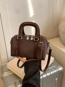 Vintage dark brown frosted Boston bag with smooth leather trim and cartoon embossing