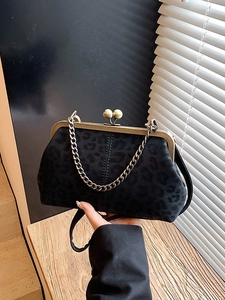 Retro leopard print doctor bag with bronze metal frame and chain for crossbody use