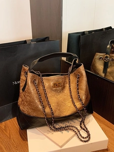 Vintage quilted chain bag with gold bronze metallic leather and black diamond stitching
