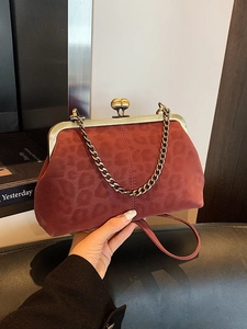 Retro leopard print shell bag in deep red suede with metal frame for crossbody use