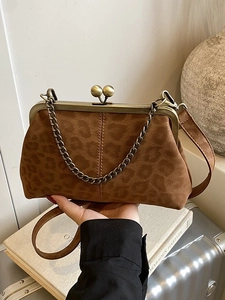Vintage leopard print shell bag with retro bronze clasp and versatile chain strap
