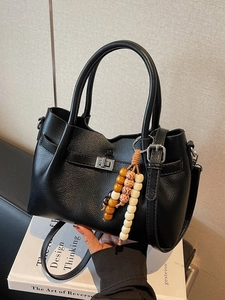 Chic black litchi pattern handbag with silver clasp and colorful wooden bead charm