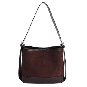 Retro vintage chocolate brown suede tote bag with minimalist leather straps on white background