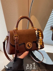Retro dark brown crossbody bag with suede flap and vintage gold twist lock